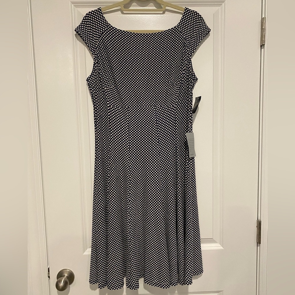 SALE Gabby Skye NWT sleeveless black and white polka dot dress flouncy bottom.